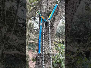 Joker Light Cambium Saver attached to a tree, showcasing its strong rings and adjustable features.