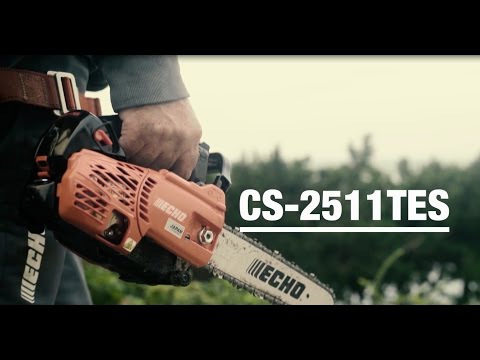 CS-2511TESC Petrol Top Handle Chainsaw 10" held by a tree surgeon for precision cutting in the field.