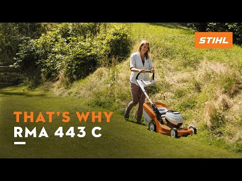 Woman using the STIHL RMA 443 Cordless Lawn Mower on a grassy area, showcasing its powerful and quiet operation.