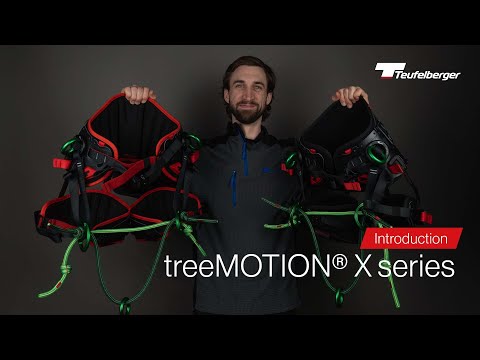 A person showcasing the Teufelberger treeMOTION X series climbing harnesses, highlighting their design for tree surgeons.