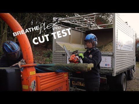 Breatheflex Pro Freestyle Chainsaw Trousers Type A Black worn by arborists during a cut test with a chainsaw.