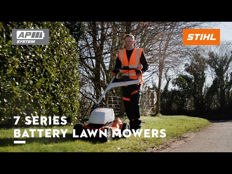 RMA 756V Professional Cordless Lawnmower used by a professional in a landscaped area.
