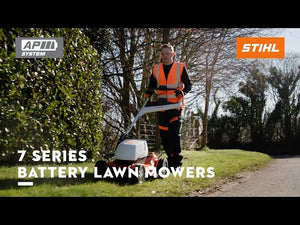 RMA 756V Professional Cordless Lawnmower used by a professional in a landscaped area.