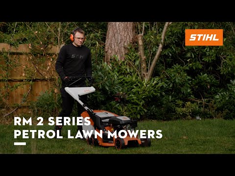 RM 253 T Self Propelled Petrol Lawn Mower being used in a garden by a man wearing headphones.