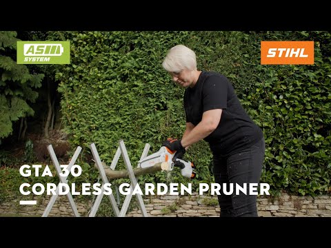 GTA 30 Cordless Battery Pruning Saw Set in use by a gardener, trimming branches with efficiency.