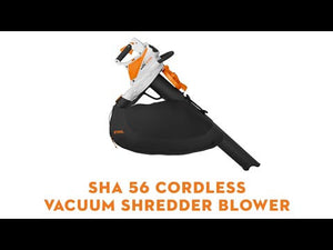 SHA 56 Cordless Leaf Vacuum Shredder shown in a side view with a black bag and orange accents.