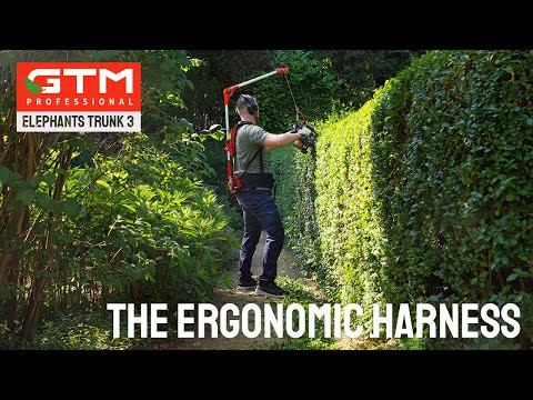 Ergonomic Harness Elephants Trunk 3 being used for hedge trimming in a garden.