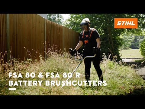 Person using FSA 80 R Cordless Trimmer in a garden, showcasing its powerful battery performance.