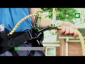 Tree surgeon demonstrating the Notch Micro Pulley with a large attachment hole and climbing ropes.