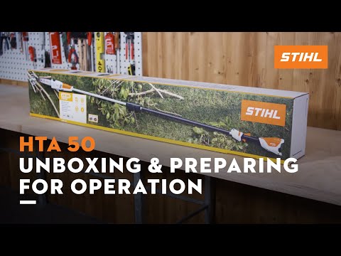 STIHL HTA 50 cordless pole pruner in box on table for unboxing and preparation, ideal for tree surgeons.