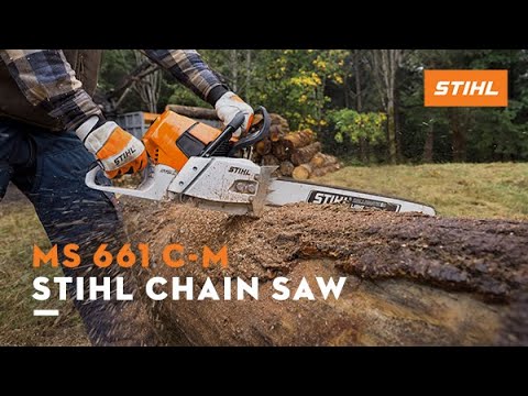 User operating the STIHL MS 661 C-M petrol chainsaw, cutting through a log outdoors.