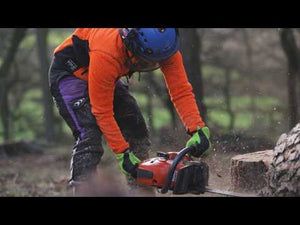 Breatheflex Chainsaw Trousers Lime Female Design Type A in action with a chainsaw outdoors.