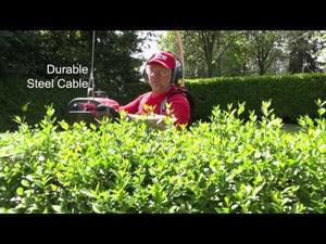 User utilizing the Ergonomic Harness Elephants Trunk 2.2 while trimming hedges in a garden.