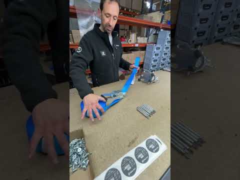Man demonstrating the Mini Cylinder 2.1 Friction Device at a workspace with tools and materials.