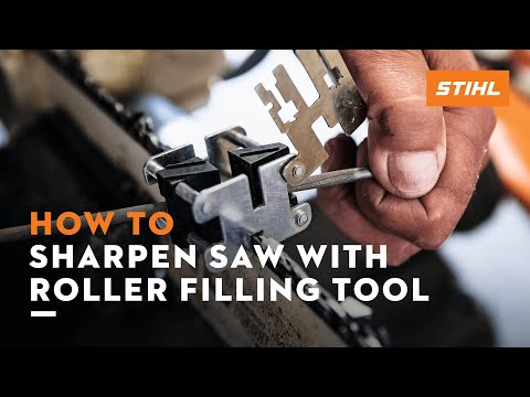 Person using STIHL FG 4 Roller Filing Tool to sharpen a chainsaw, demonstrating precision for tree surgeons.