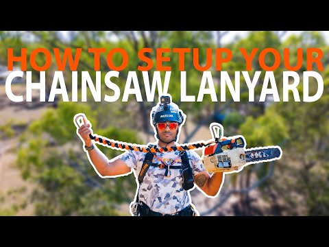 Tree surgeon demonstrating how to set up a chainsaw lanyard for safe tree cutting and climbing.