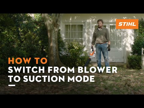 Man demonstrating how to switch STIHL SHA 56 from blower to suction mode in a garden setting.