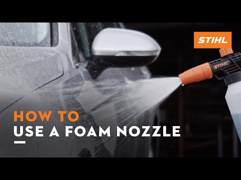 Demonstrating how to use the STIHL foam nozzle for effective vehicle cleaning.