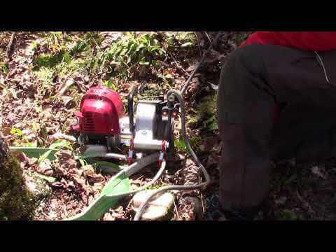 Portable winch PCW4000 kit in use for tree surgery, demonstrating heavy load pulling capabilities.