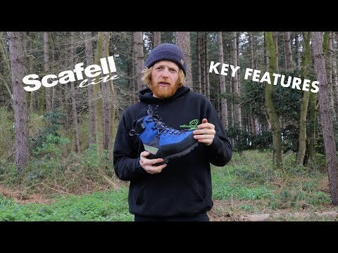 Scafell Lite Orange Chainsaw Boots Class 2 being showcased for key features in a forest.