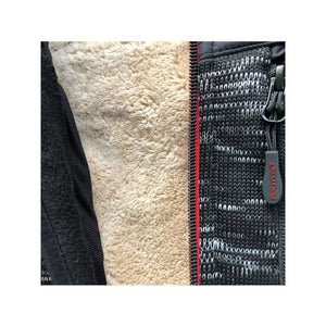 Close-up of the inner lining and zipper detail of the Protos Inuit Winter Vest in Black, featuring warm insulation.