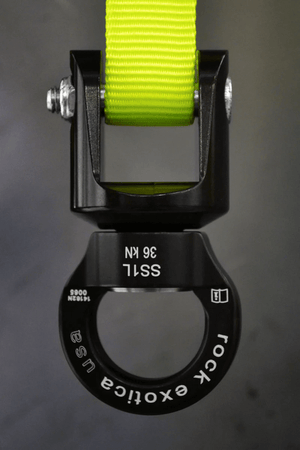Rock Exotica SS1 swivel shackle with yellow strap, designed for tree surgeons for enhanced durability and space-saving performance.