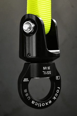 Rock Exotica SS1 shackle swivel in black with yellow webbing, designed for tree surgeons, showcasing enhanced durability.