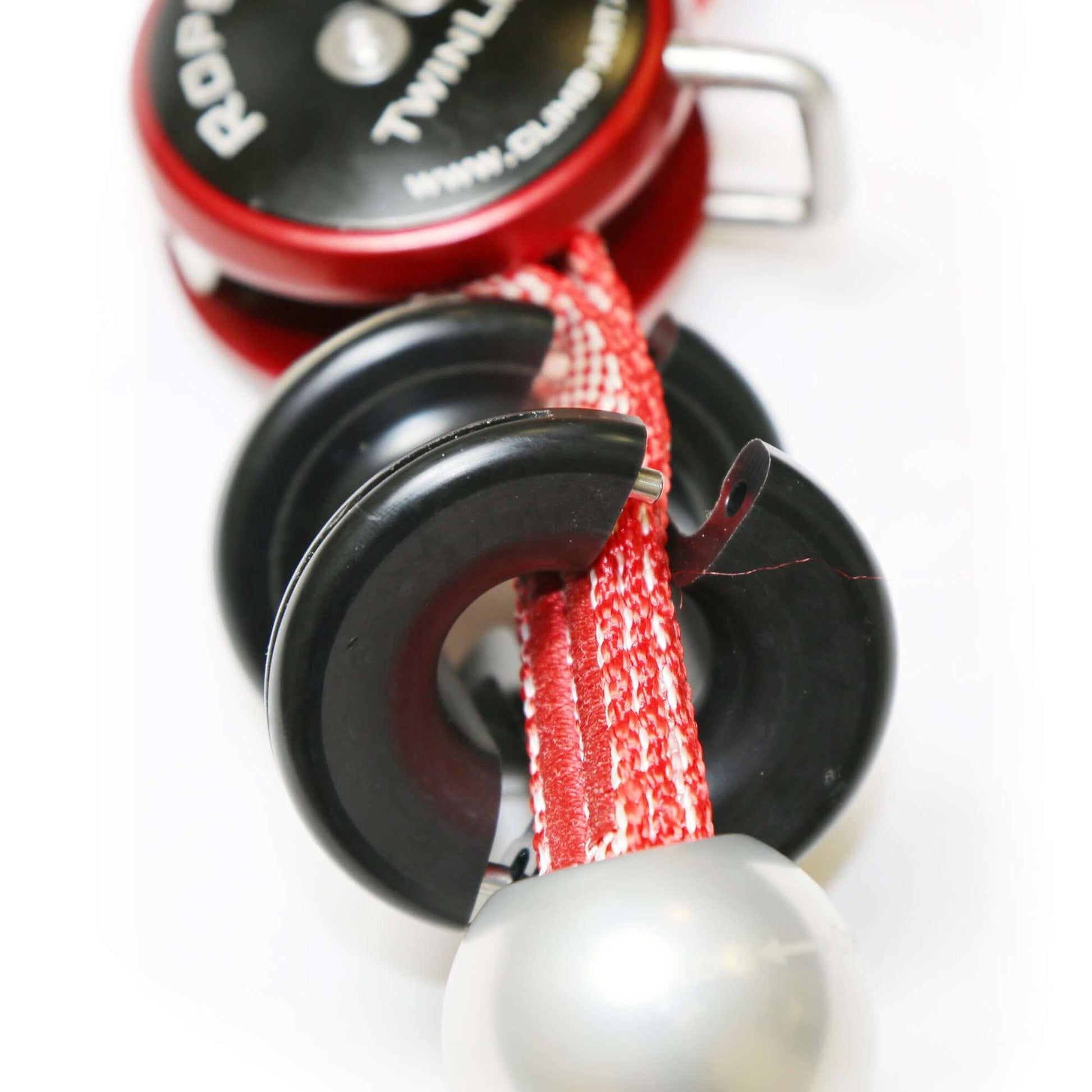 Close-up of ART RopeGuide TwinLine Cambium Saver, essential gear for tree surgeons, featuring robust pulleys and spliced rope.