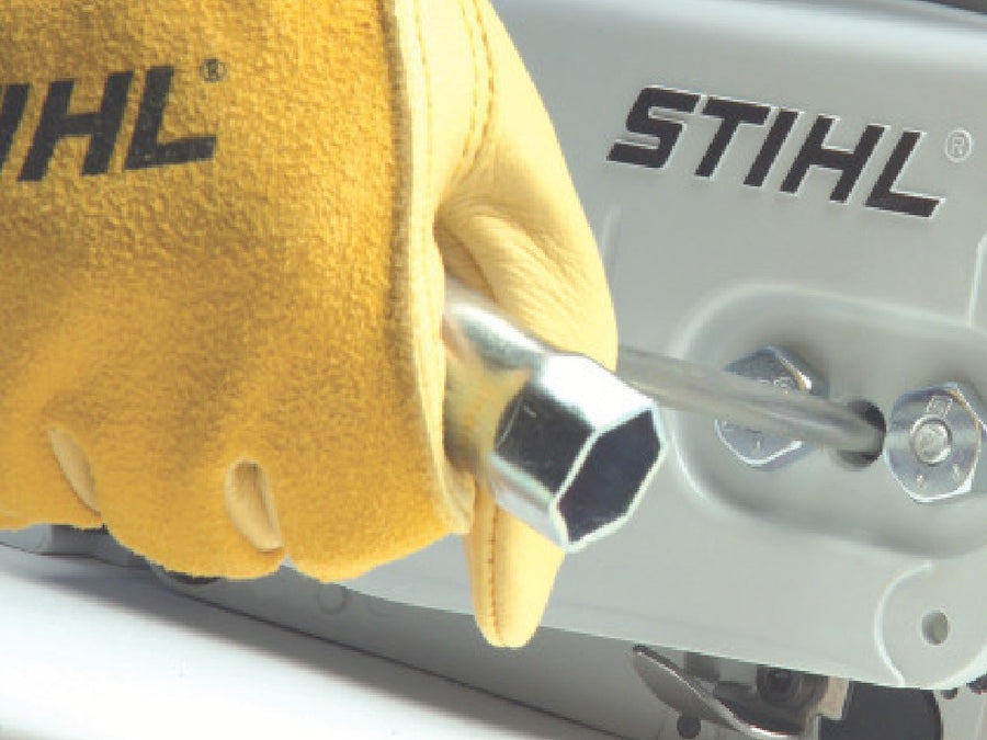 Side-access chain tensioner